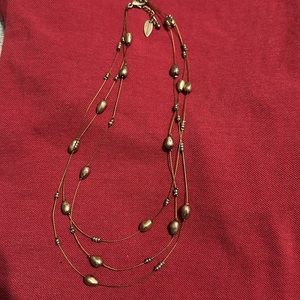 Bronze tones on 3 strand necklace by Coldwater Creek